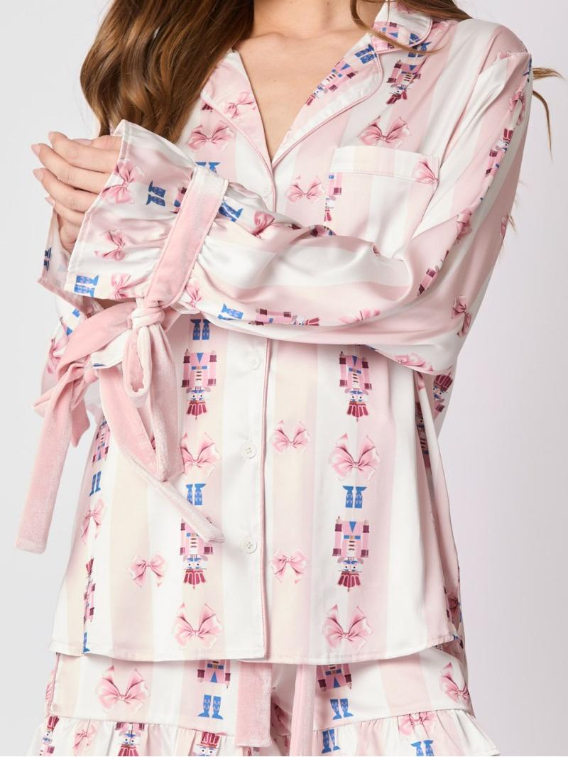 Roze pyjamaset met strikmanchetten