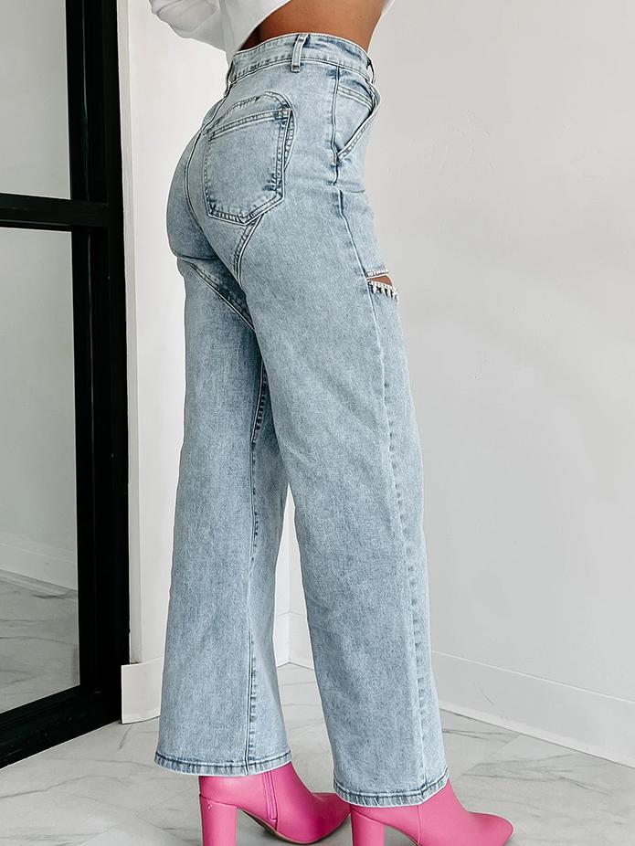 Jeans rectos desgastados con detalles de strass