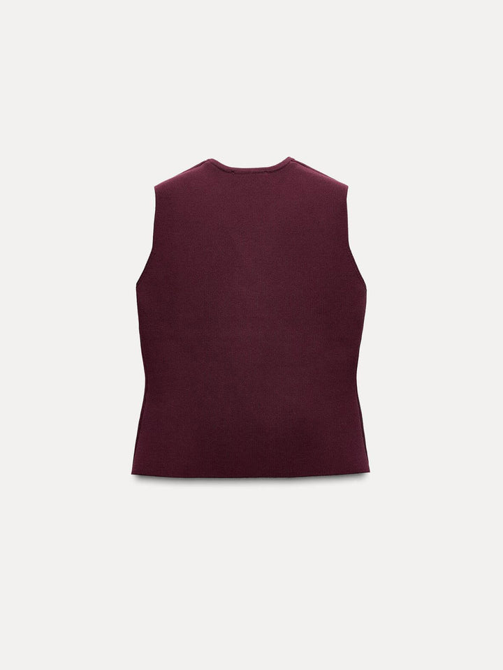 Knitted Vest At Pleated Skirt