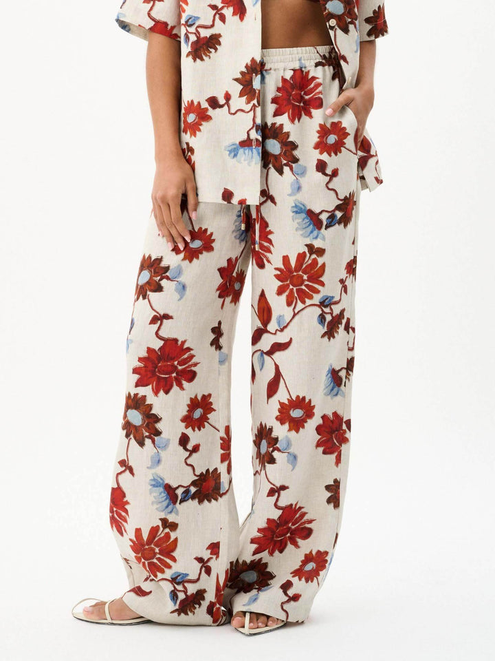 Pantalones anchos con cordones y estampado floral exquisito