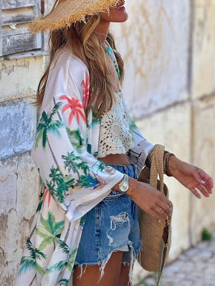 Vestido tipo pareo largo con cintura anudada y estampado botánico estilo vacaciones