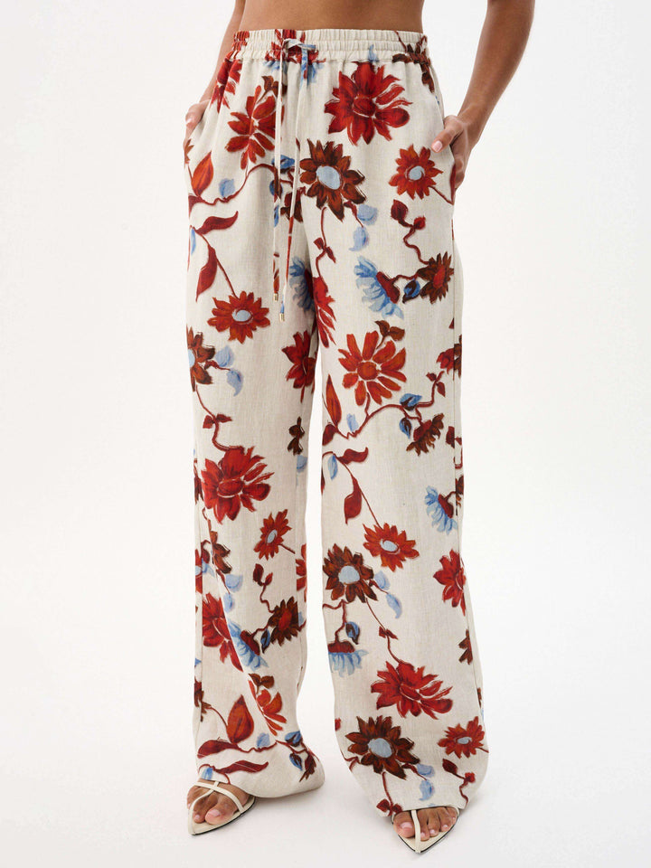 Pantalones anchos con cordones y estampado floral exquisito