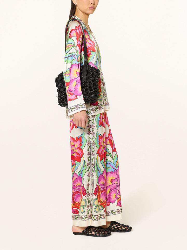 Completo camicetta in satin con stampa floreale vivace e pantaloni a gamba larga
