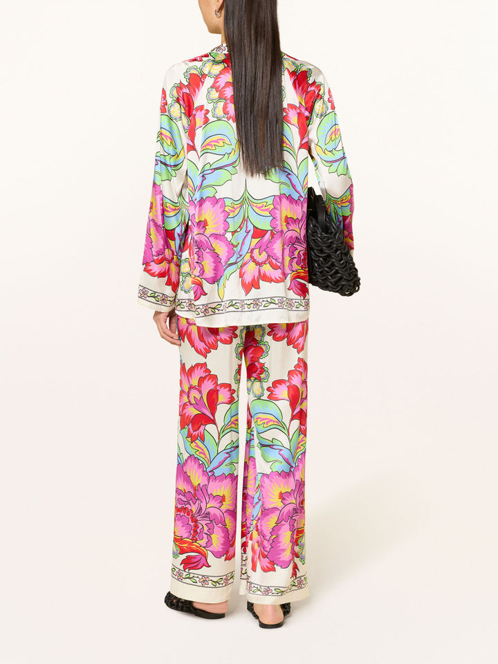 Completo camicetta in satin con stampa floreale vivace e pantaloni a gamba larga