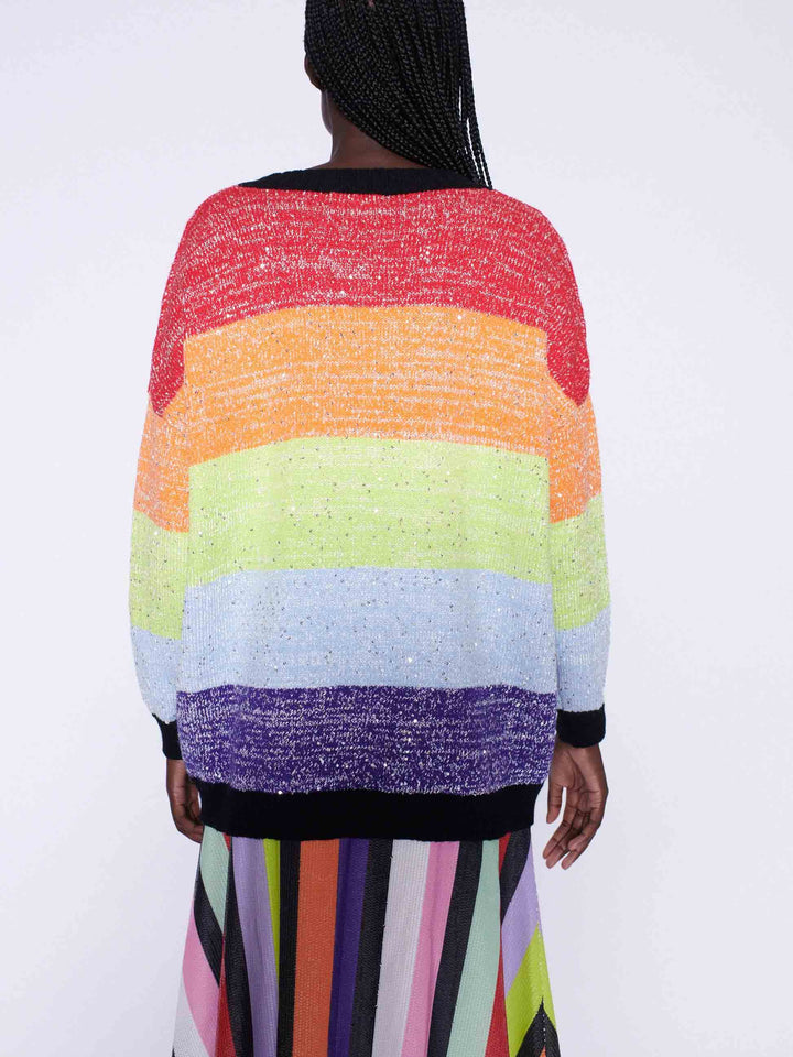 Strickjacke mit Regenbogenstreifen und Pailletten und Rock mit Streifen und mehreren Pailletten