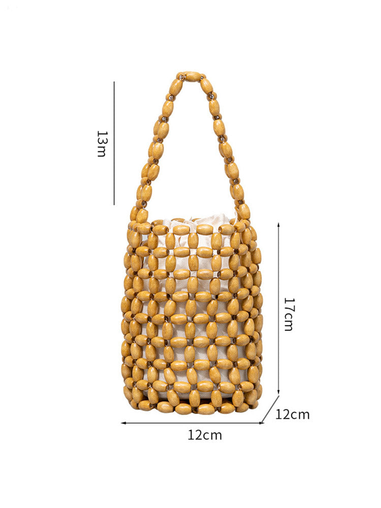 Vydlabaná kyblíková taška z dřevěných korálků
