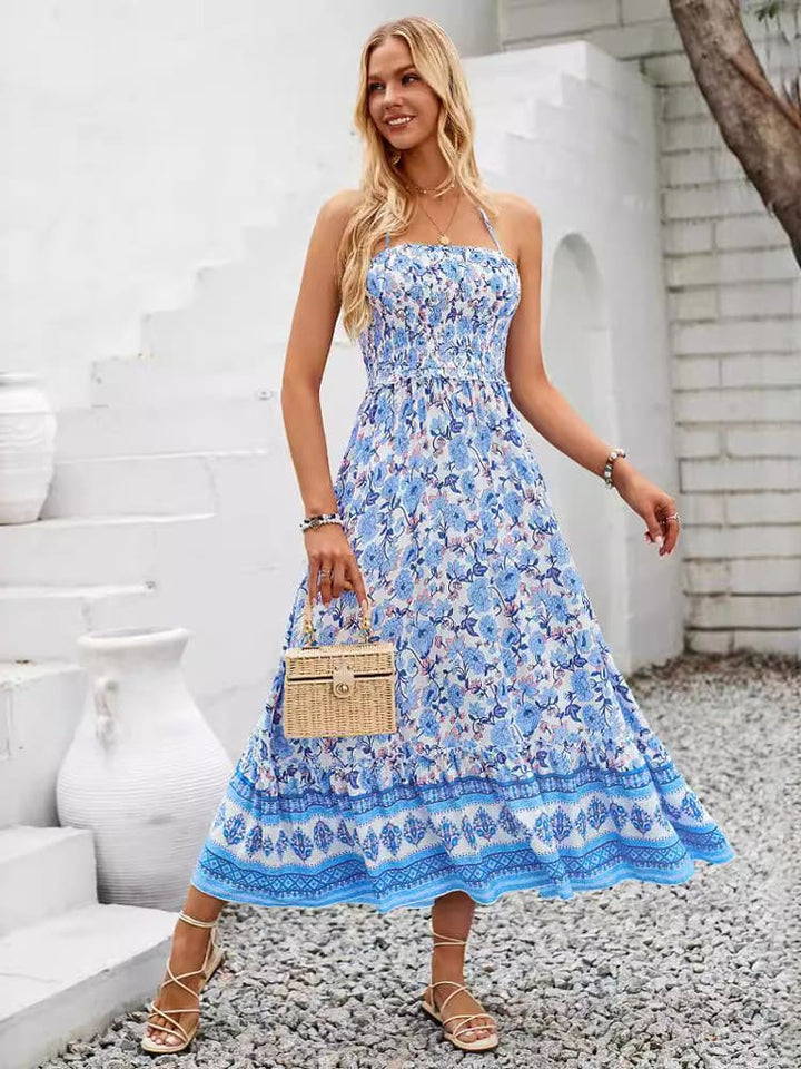 Maxi-jurk met gesmokte borst en halterhals met bloemenprint