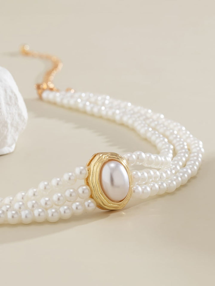 Kort halskjede med imiterte perler og turkis perler