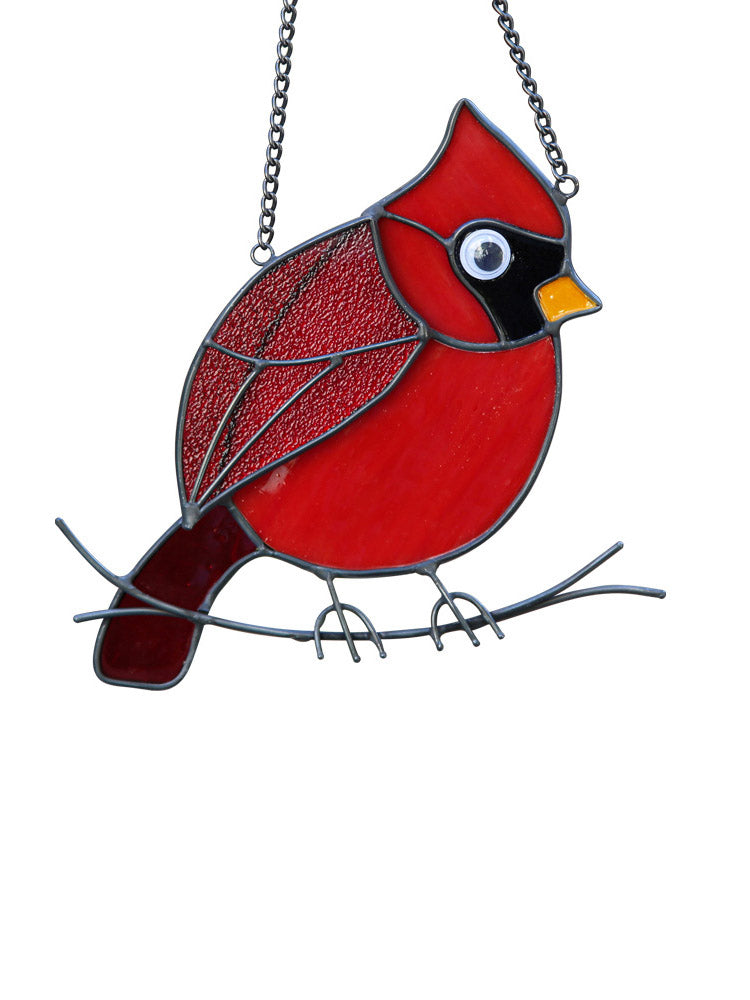 Hangende decoratie met rode gevederde vogel